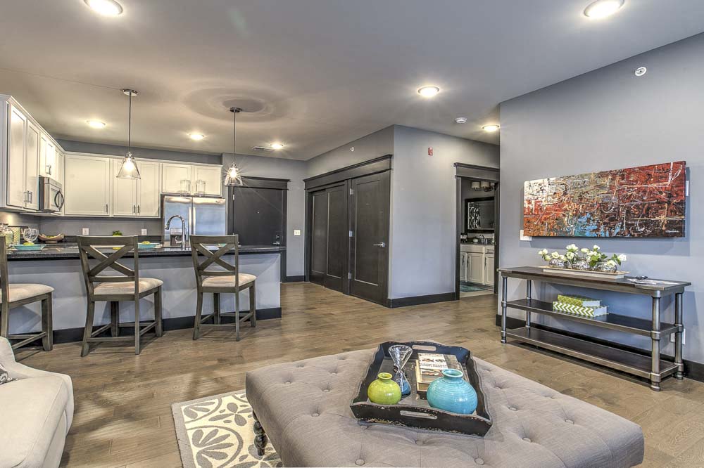 Complete view of furnished living room and kitchen spaces at The Helen