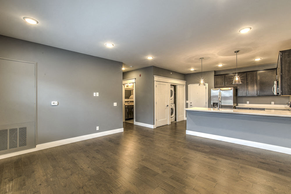 Open floorplan living room and kitchen space at The Helen