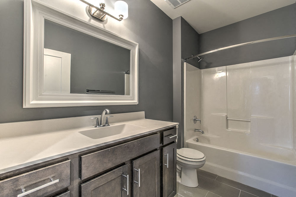 Bathroom with lots of counter space and a bathtub at The Helen
