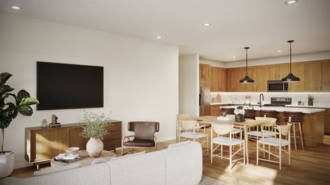 A modern living room with a grey sofa and a wooden cabinet.