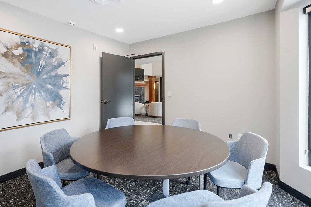 The private conference room with a large table and chairs