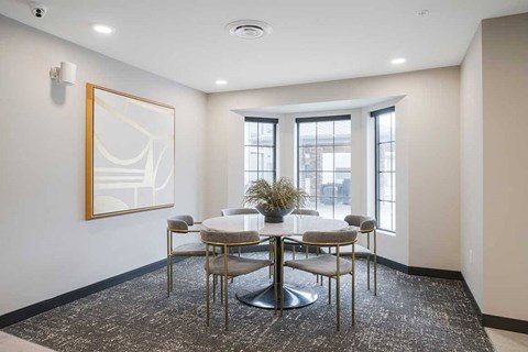 The dining room of the clubhouse kitchen featuring a large bay window