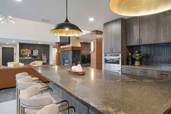 The clubhouse kitchen with large central island and barstools