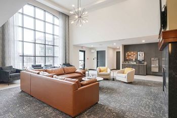 The clubhouse lounge featuring a floor to ceiling window and plenty of seating options