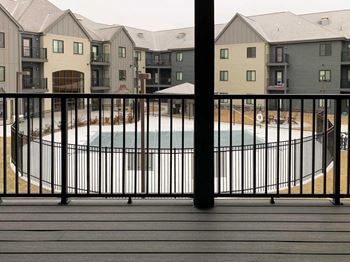 deck view of pool with black railing