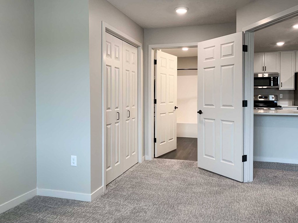 a bedroom with closet and on-suite bathroom