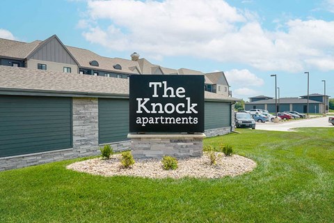 the front monument sign for The Knock Apartments in Lincoln, NE
