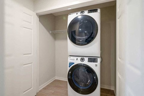 A stackable front-loading washer and dryer with additional storage space