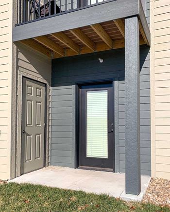 a patio with an outdoor storage closet