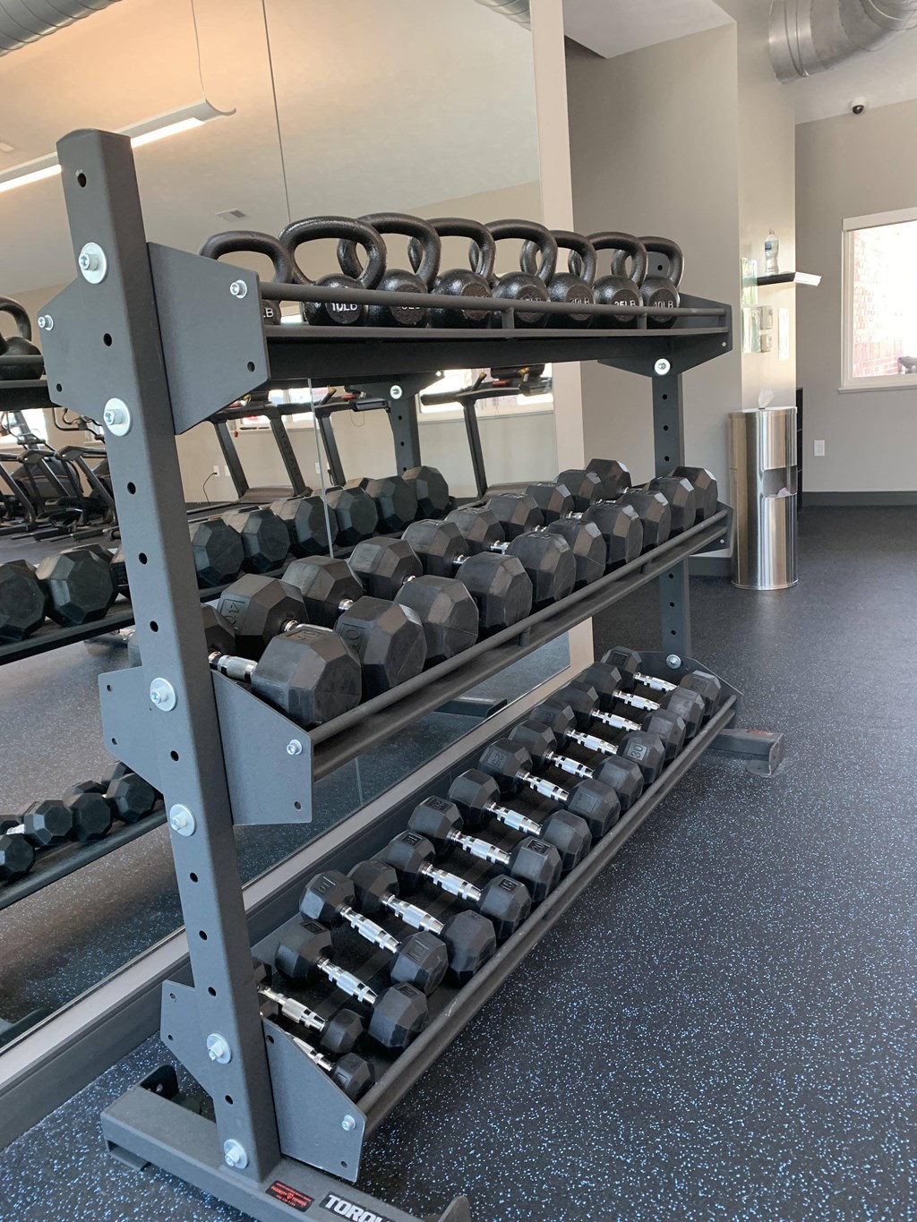 24 hour fitness center with kettlebells and dumbbells at the northbrook apartments in lincoln nebraska