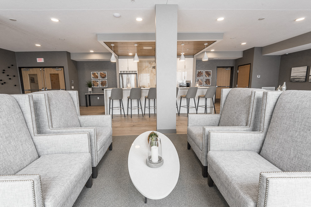 View of gray seating near the gourmet kitchen in The Preserve's amenity space
