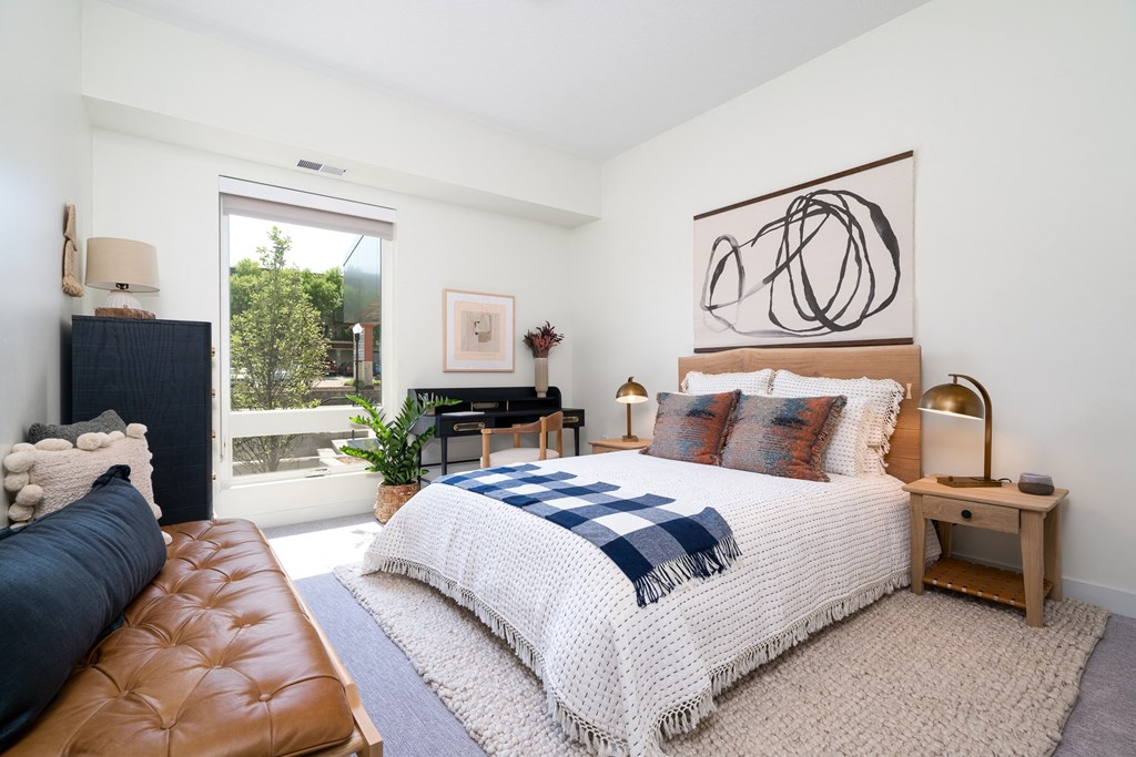 Bedroom with large king sized bed and large window