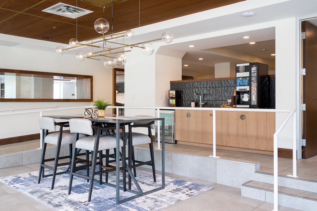 Coffee bar on back counter space with table and seating