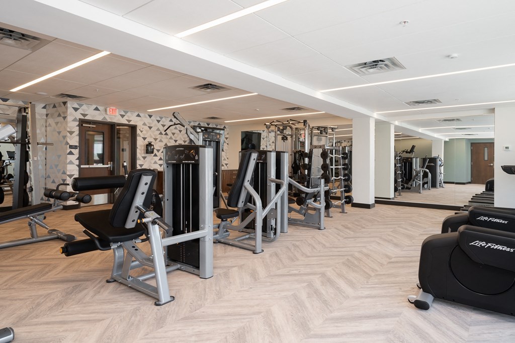 Community gym with a variety of workout and fitness equipment at The Rowan