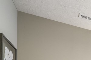 Interiors-Bedroom with ceiling fan Interiors-1 bedroom apartment bedroom with ceiling fan, queen bed and chair