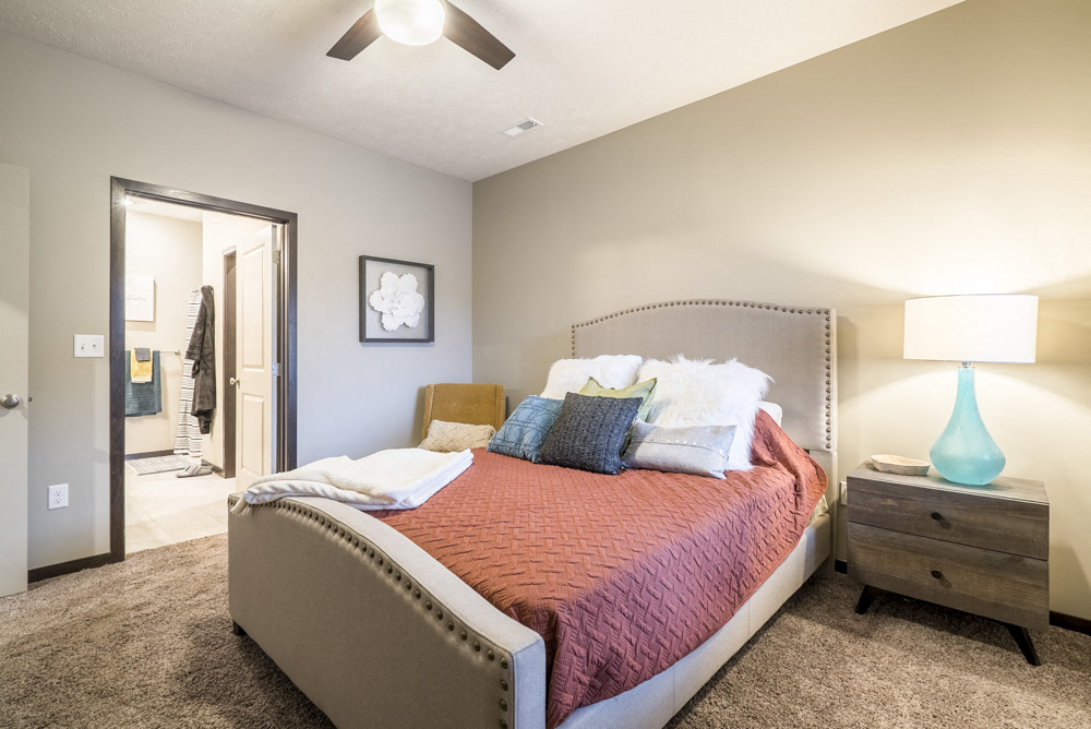 Interiors-Bedroom in 1 bedroom apartment with view of attached bathroom