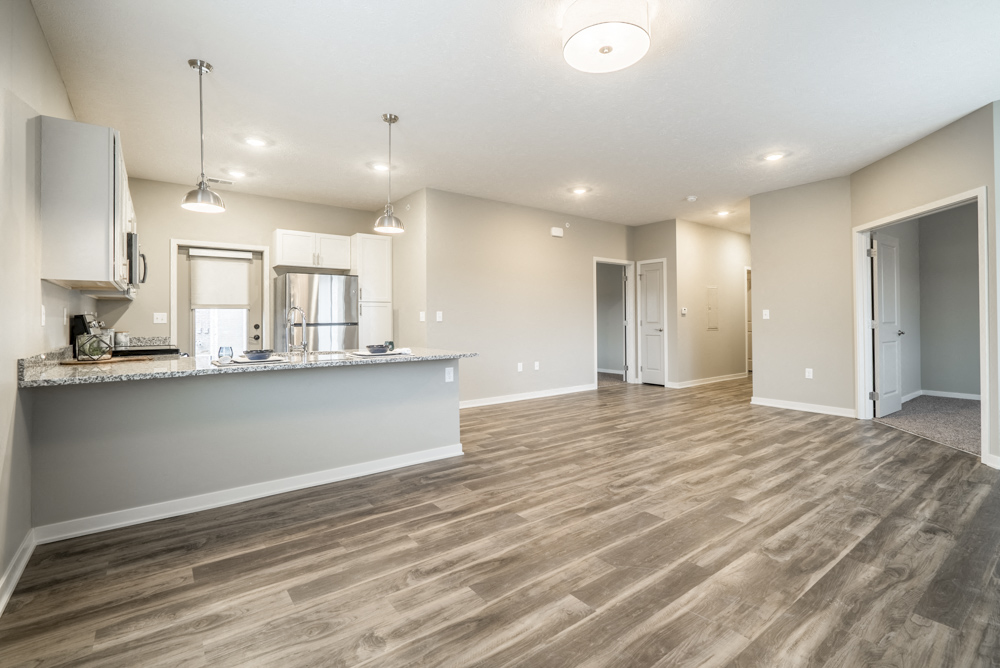 Interiors-Contemporary design scheme showcasing open layout with living room and kitchen at The Villas at Falling Waters