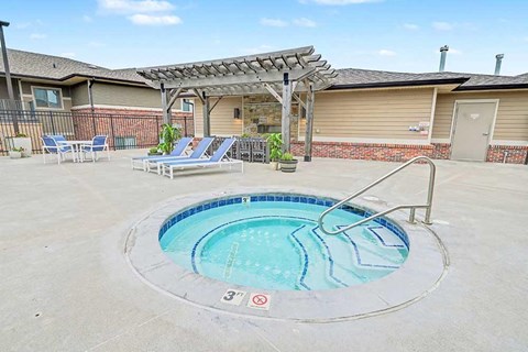 A round above ground pool with a metal railing around it.