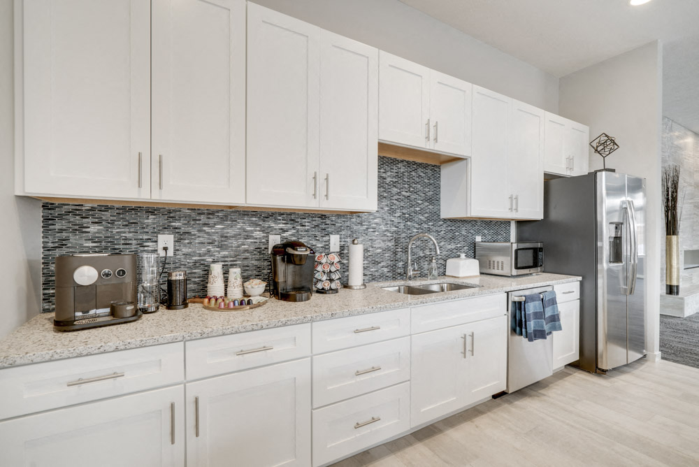 Clubhouse kitchen counter with two different kinds of coffee machines