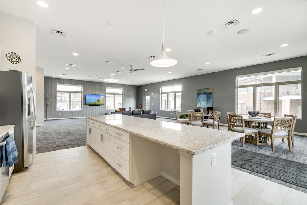Resident clubhouse with kitchen and TV lounge at The Villas at Falling Waters townhomes in west Omaha NE