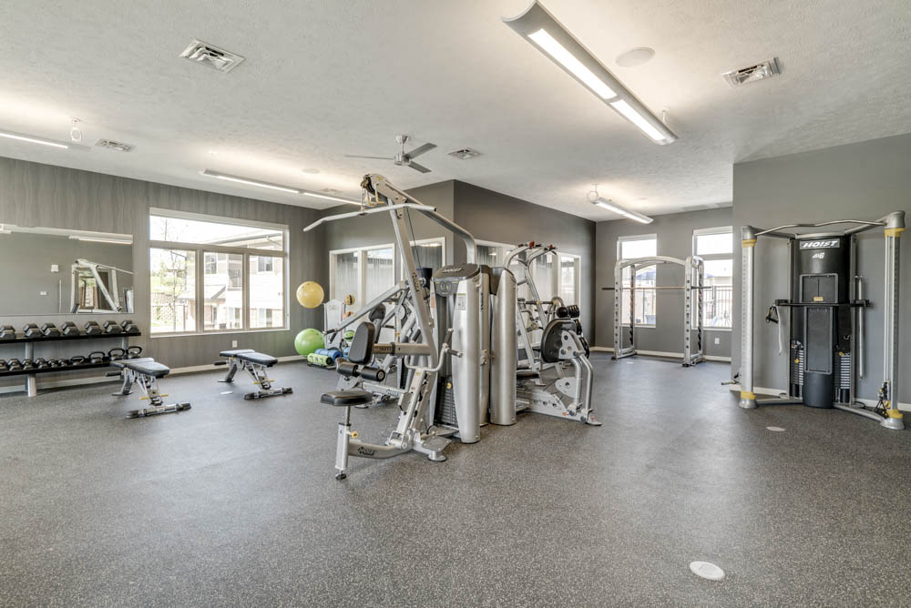 Fitness center with free weights and weightlifting machines at The Villas at Falling Waters townhomes in West Omaha NE