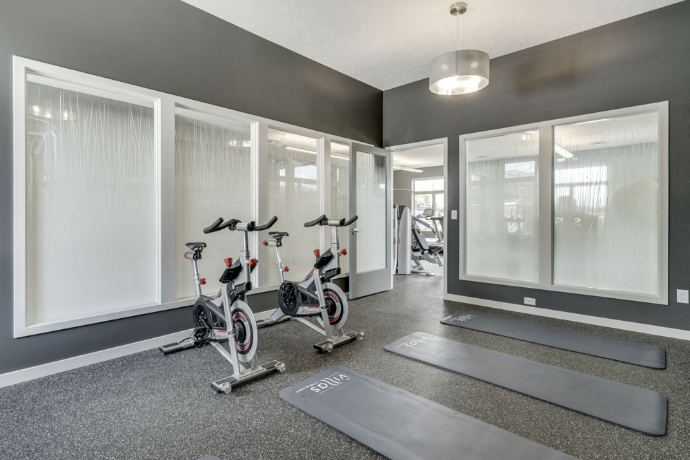 Yoga/spin studio at The Villas at Falling Waters luxury townhomes for rent in west Omaha NE
