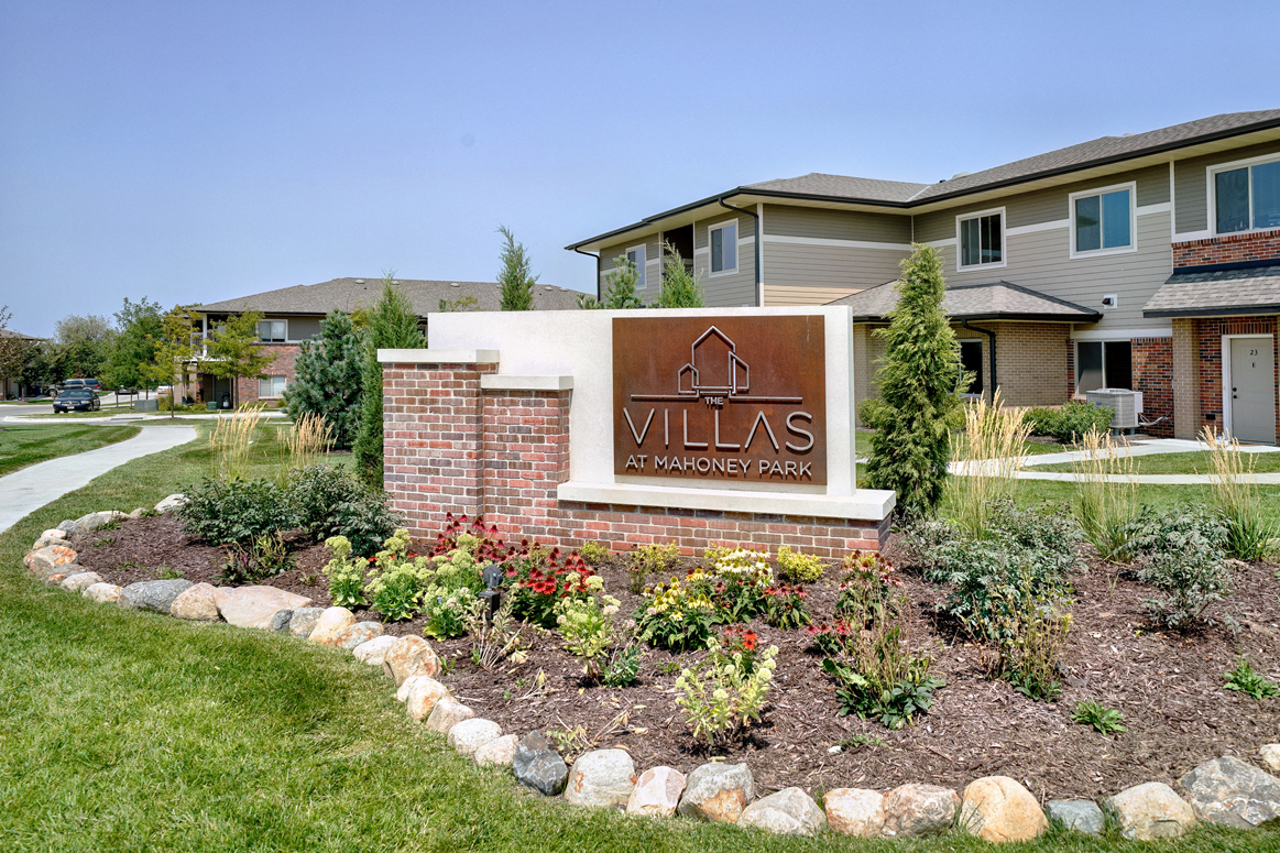 Copper and brick exterior sign that reads