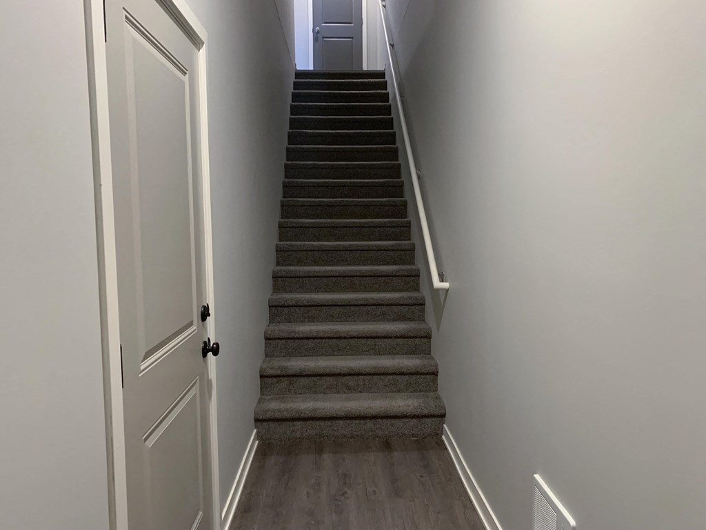Stairs leading to second story villa at the villas at mahoney park