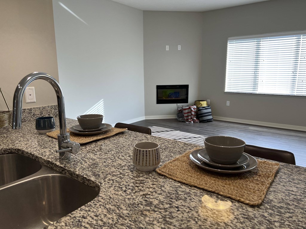 Beautiful granite countertops in the kitchen of the glacier floorplan at the villas at mahoney park