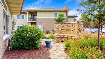 Relax with friends by the private fire pit at The Villas at Wilderness Ridge luxury apartments in southwest Lincoln NE 68512 - Photo Gallery 77