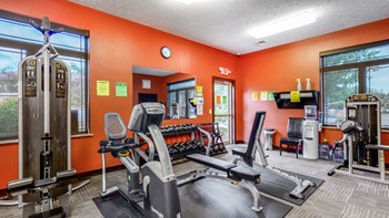 Expansive fitness room with modern equipment at The Villas at Wilderness Ridge luxury apartments in southwest Lincoln NE 68512 - Photo Gallery 23