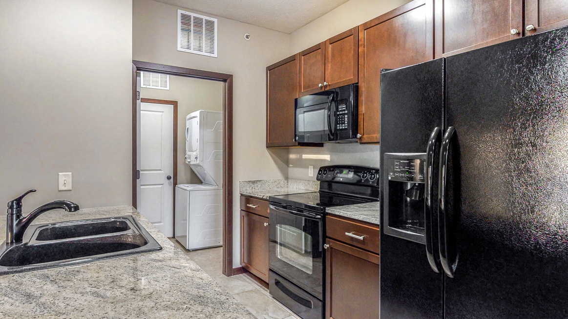 A separate laundry room is located right off the kitchen in the 2 bedroom Ash at The Villas at Wilderness Ridge in southwest Lincoln NE 68512 - Photo Gallery 46