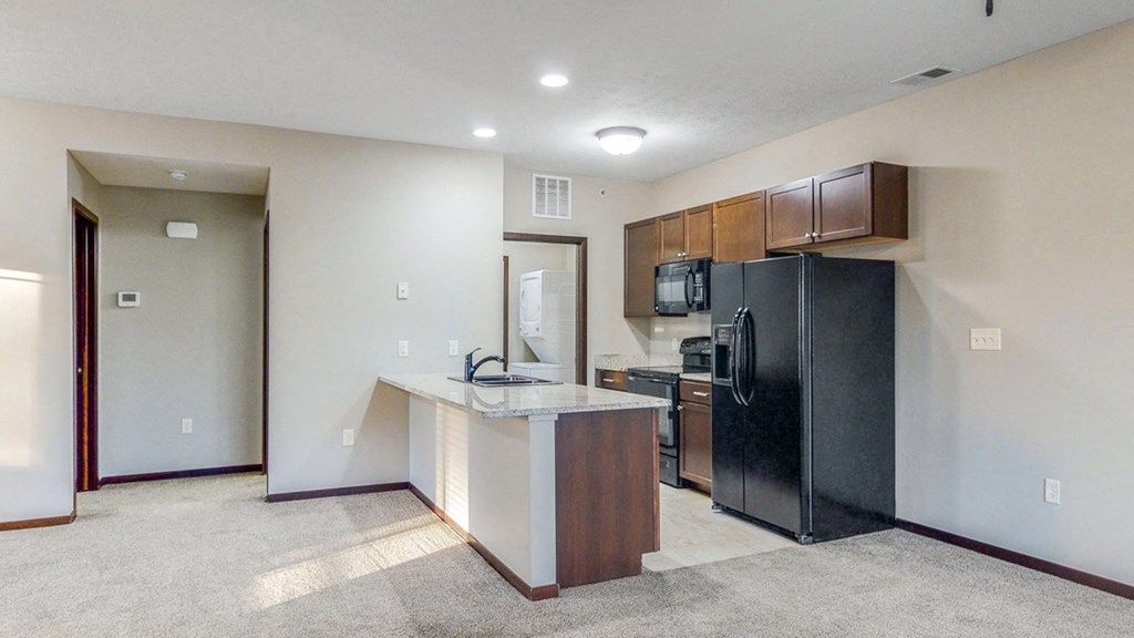Spacious kitchens with granite countertops at The Villas at Wilderness Ridge luxury apartments in southwest Lincoln NE 68512