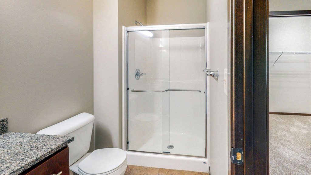 The master bath in the Ash features a shower with glass doors.