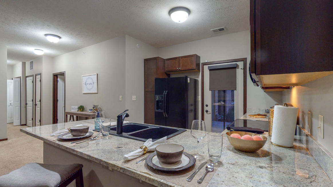 The 2-bedroom Cedar features a spacious kitchen with peninsula counter and gorgeous countertops. - Photo Gallery 63