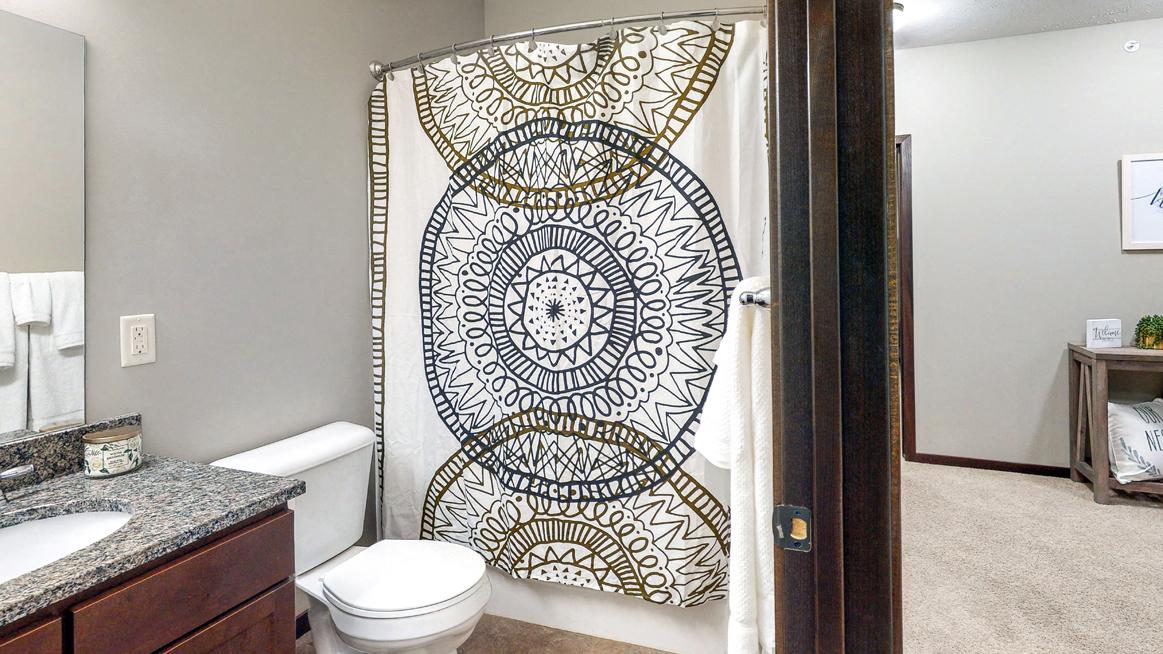 This full bathroom with tub/shower combo is available in the Cedar floor plan at the Villas at Wilderness Ridge - Photo Gallery 66