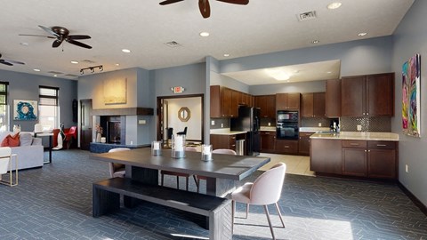 a kitchen and dining room with a table and chairs