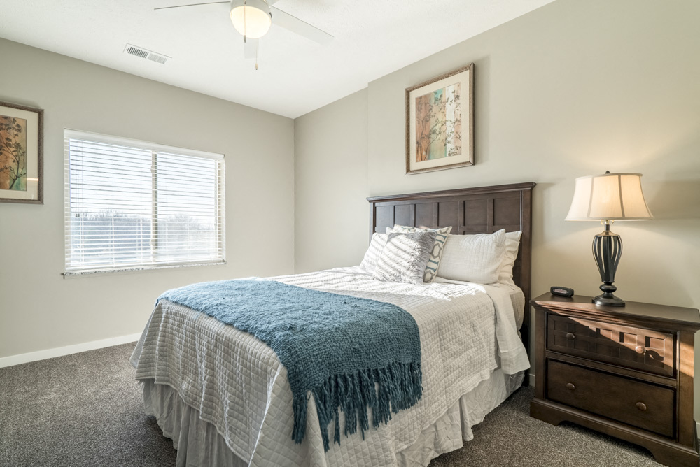 Spacious bedroom with lots of natural lighting at The Villas at Mahoney Park