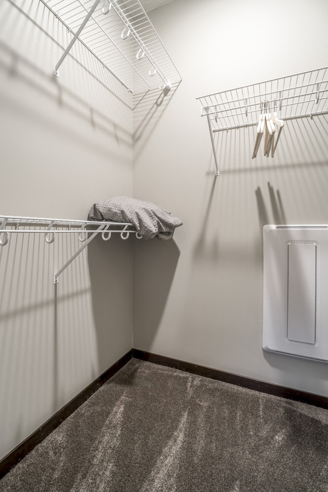 Walk in closet with shelves providing extra storage at The Villas at Mahoney Park