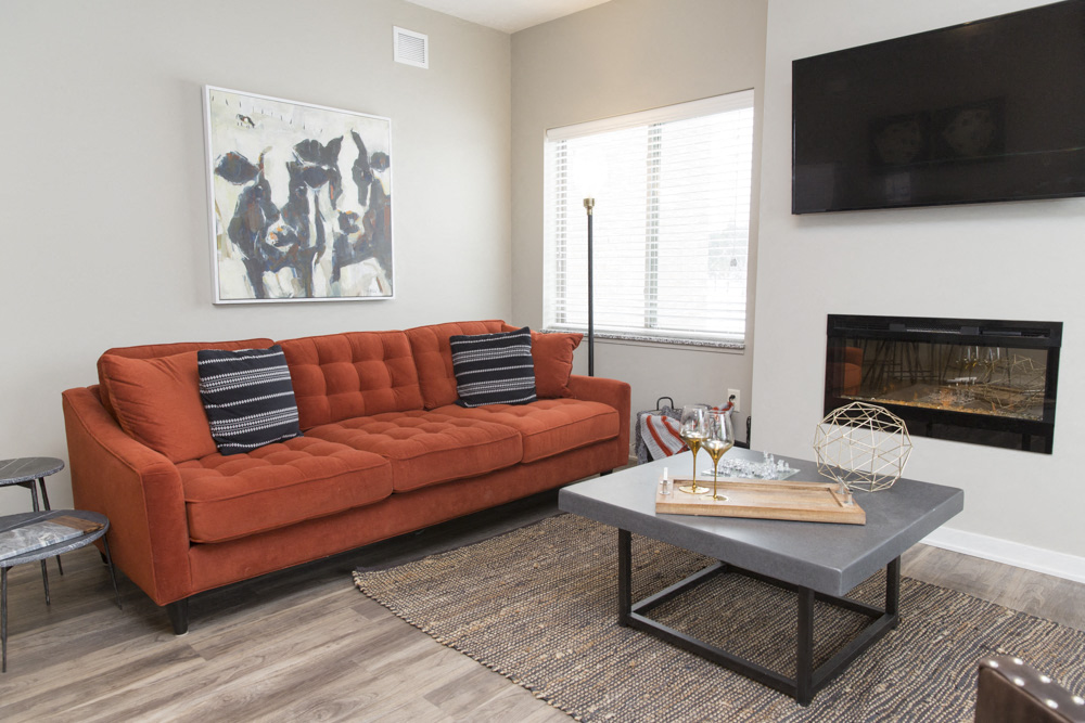 Living room space with fireplace at The Villas at Mahoney Park