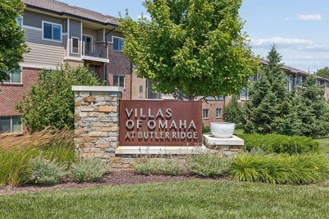 A sign that says Villas of Omaha at Butler Ridge.