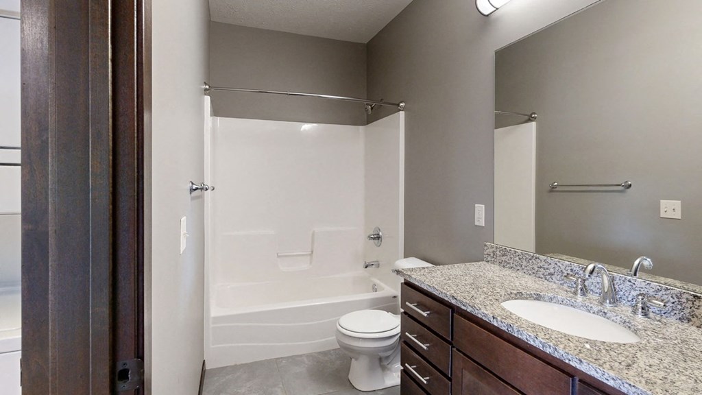 a bathroom with a combination shower and tub