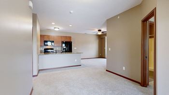 a view of the kitchen and living room from the dining room