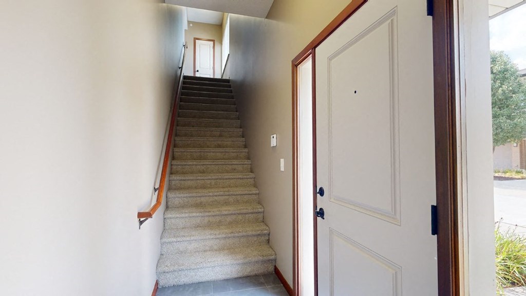 a private staircase leading from the front door to the