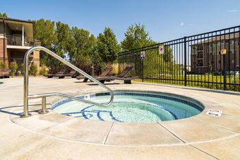 round hot tub on the pool deck at Villas of Omaha at Butler Ridge apartments