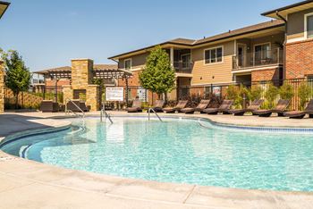 resort style swimming pool outside the clubhouse at The Villas of Omaha at Butler Ridge