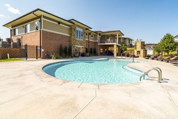 resort style swimming pool outside the clubhouse at The Villas of Omaha at Butler Ridge