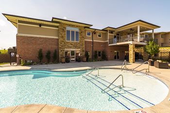 resort style swimming pool outside the clubhouse at The Villas of Omaha at Butler Ridge