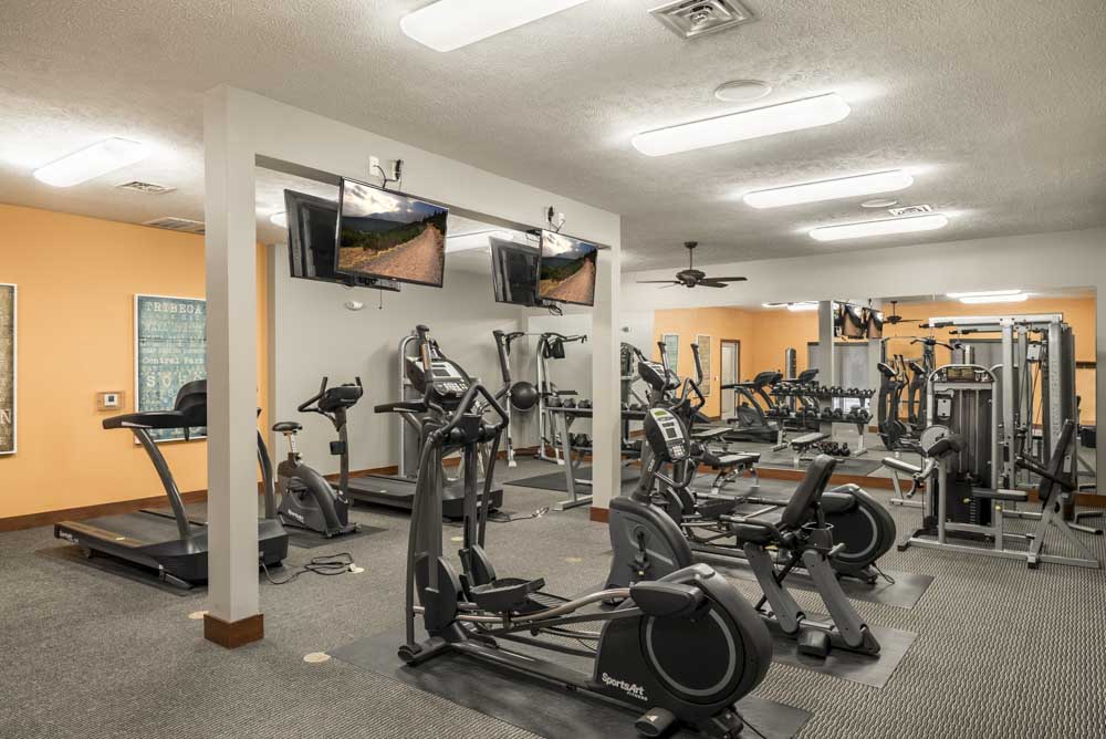 24-hour fitness center with cardio equipment at Villas of Omaha townhome apartments in northwest Omaha NE 68116