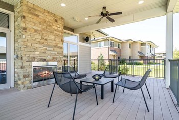 Outdoor fireplace with seating at Villas of Omaha in northwest Omaha NE 68116 - Photo Gallery 53